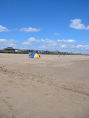 The family can enjoy a safe happy time on the beach. Copyright &copy; Maria Vincent 2008